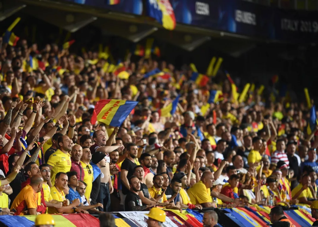 Supporters cheering for Romania in a crowd