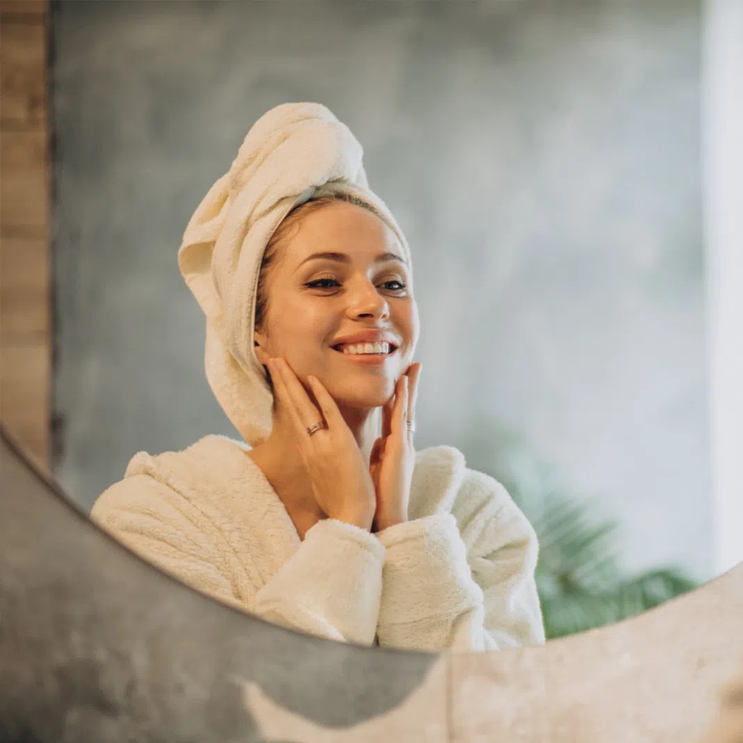 Woman applying beauty products