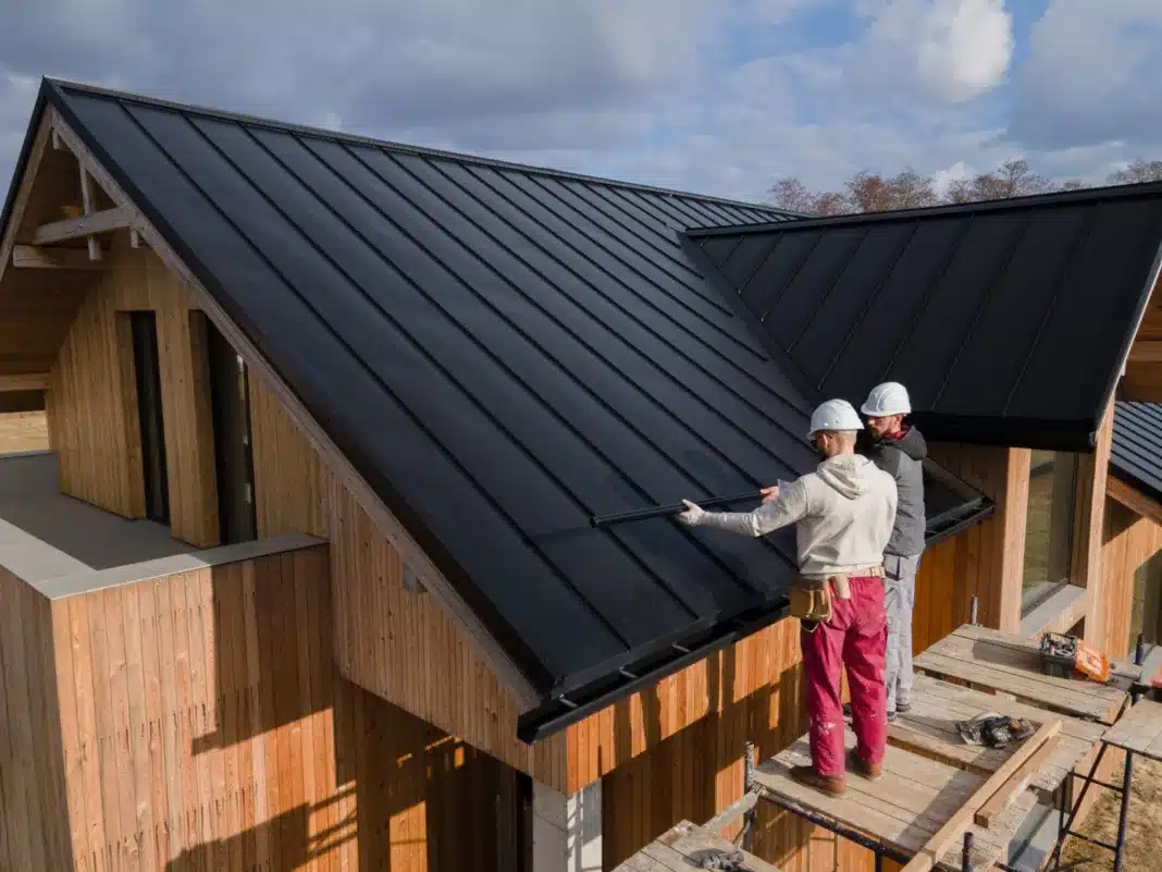 UK roofers working together with helmets