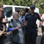 Alfred Bulai este escortat de politisti in timpul unei perchezitii, in Bucuresti, 4 septembrie 2024. Inquam Photos / Cosmin Enache